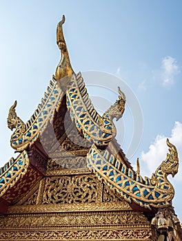 Carved floral pattern in the traditional Thai style on the gable of the Thai church