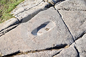The carved footprint on the summit rock at Dunadd fort, Argyll, Scotland