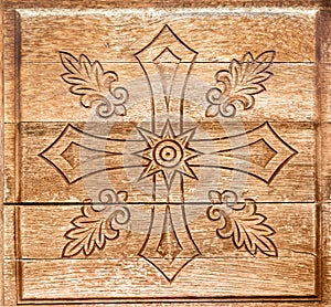 Carved geometric pattern on wood background