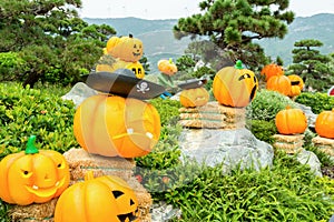 Carved golden pumpkins and background of stone and mountains
