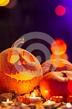 Carved halloween pumpkin on leaves