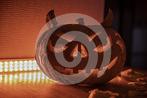 Carved Halloween pumpkin with red backlight