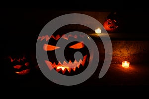 Carved halloween pumpkins - jack O`lantern-  glowing in the dark