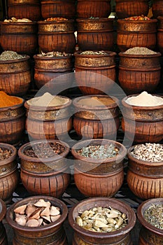 Carved handmade pots of spices, Morocco