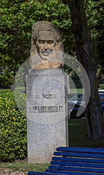 Carved head Sculpture of JosÃ© Luis Hidalgo Poet. Situated at the coastal park in Santander. photo