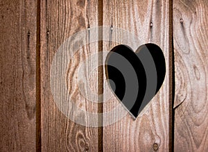 Carved heart symbol in wooden door