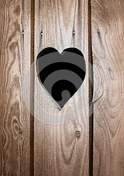 Carved heart symbol on wooden door