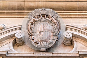 Carved heraldic shield detail of city hall ajuntament de Palma from Plaza de Cort square