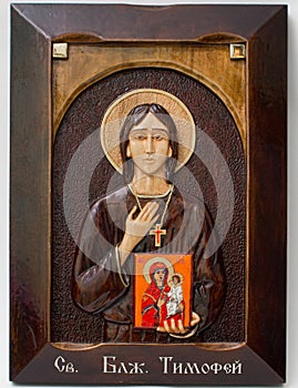 Carved icon from wood handmade. Holy timothy