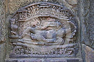 Carved idol of Lord Vishnu on the inner wall of a small shrine. Built in 1026 - 27 AD during the reign of Bhima I of the Chaulukya