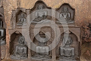 Carved idols of Digambar Jain Tirthankaras on the rock of Mangi Tungi, Nashik, Maharashtra photo