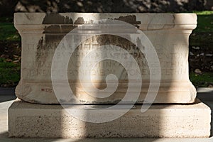 Carved Inscription on a pedestal