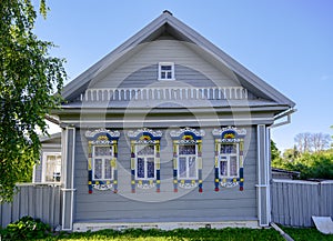 Carved multicolored platbands on a wooden house in Kazakovsky Lane in Pereslavl-Zalessky, Russia