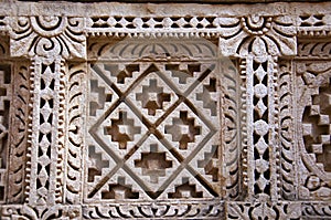 Carved Patola Double Ikat pattern on the inner wall of Rani ki vav, an intricately constructed stepwell on the banks of Saraswat