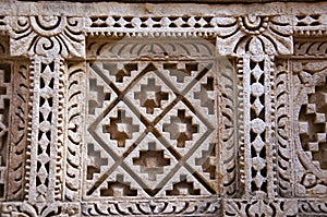 Carved Patola Double Ikat pattern on the inner wall of Rani ki vav, an intricately constructed stepwell on the banks of Saraswat photo