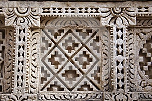 Carved Patola (Double Ikat) pattern on the inner wall of Rani ki vav photo