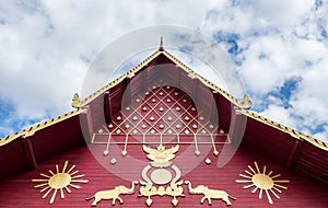 Carved pattern in the traditional Thai style on the gable of the Thai church