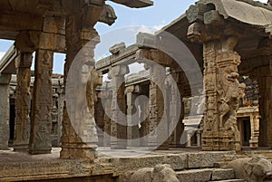 Carved pillars of at the entrance of the maha-mandapa, Achyuta Raya temple, Hampi, Karnataka. Sacred Center. View from the north-e photo