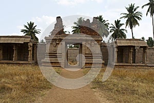 Carved pillars of the inner courtyard, cloisters or pillared verandah and the east gopura. Achyuta Raya temple, Hampi, Karnataka.