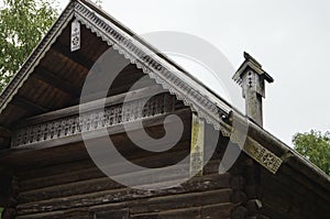 Carved pipe of wood, sloping roof on the old house, built in 1495, wooden architecture