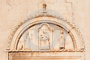 Carved portal of medieval St. Dominic monastery photo