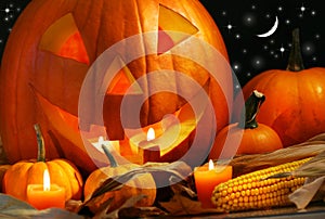 Carved pumpkin with candles photo