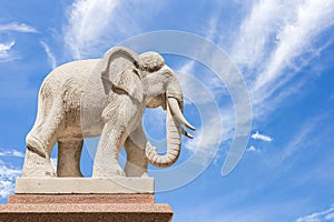 Carved sandstone elephant on blue sky background