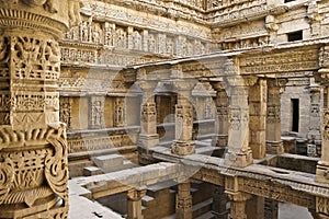 Carved sandstone pillars of Rani-ki-Vav step well, India