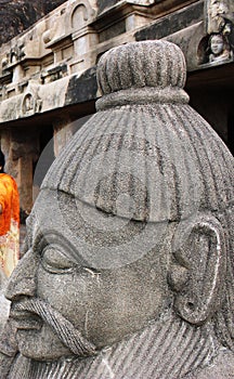 Carved statue of a monk