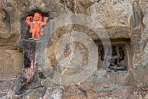 Carved statues of Gods on the rock of Mangi Tungi hills. Nashik, Maharashtra photo