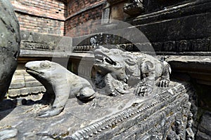 Carved stone animals on a public fountain. Kathmandu, Nepal