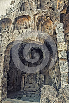 A carved stone Buddha, carved from the rock, Longmen Grottoes an