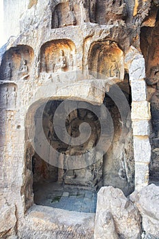 A carved stone Buddha, carved from the rock, Longmen Grottoes an