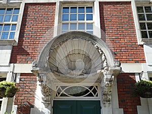 Carved Stone Clam Shell Canopy over Doorway