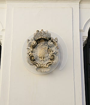 Carved stone coat of arms in Sanlucar de Barrameda city, Andalusia