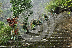 Carved stone dragon. Ascending staircase to Hang Mua pagoda, Ninh Binh, Vietnam photo