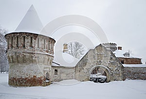 Carved stone gate and tower Fedorovsky town cloudy winter day. Tsarskoye Selo