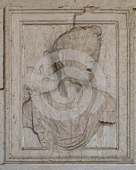 Carved stone relief of Saint Jerome flanking the left side of the  entrance to the Jeronimos Monastery in Lisbon, Portugal. photo