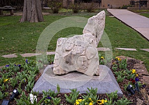 Carved stone untitled sculpture in a garden at the Catholic Church of Saint John the Baptist in Edmond, Oklahoma.