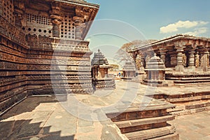 Carved stone walls of beautiful temple buildings of Halebidu, with reliefs of 12th century Hoysaleshwara temple, India