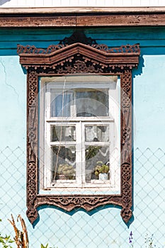 Carved window in old National russian wooden house