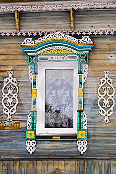 Carved window in old russian wooden country house