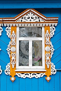 Carved window of old wooden house