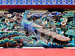 Carved wooden bird at the Nikko Tosho-gu shrine , Japan.