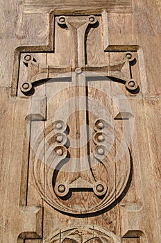 Carved wooden cross on a church door