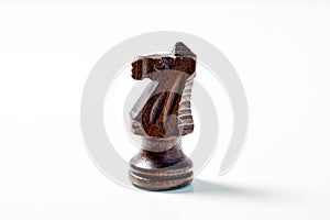 Carved Wooden Knight Chess Piece on White in Profile