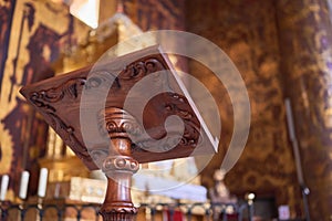 Carved wooden lectern in a church altar