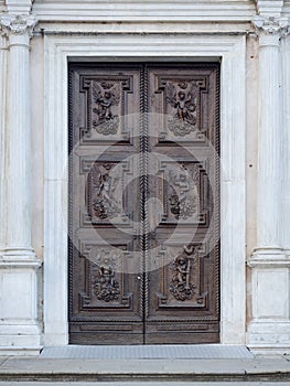 Carved wooden portal with scenes of saints from an ancient church