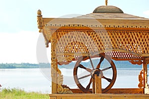 Carved wooden tower over the well at lake Igjboolat . detail, circumstance