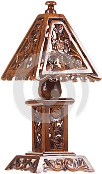 Carved wooden vintage table lamp isolated